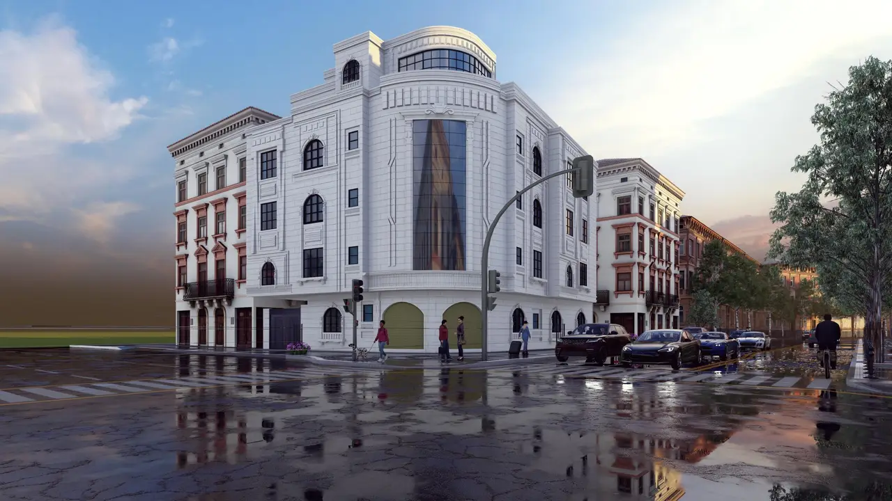 مبنى بزاوية دائرية — حجر أبيض وأقواس — تصميم مكتب الفروي في صنعاء